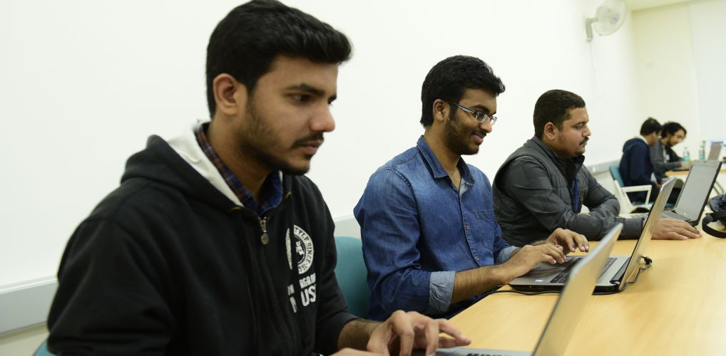 A group picture of Hackathon 2018 with students and teams coding and trying to understand accessibility